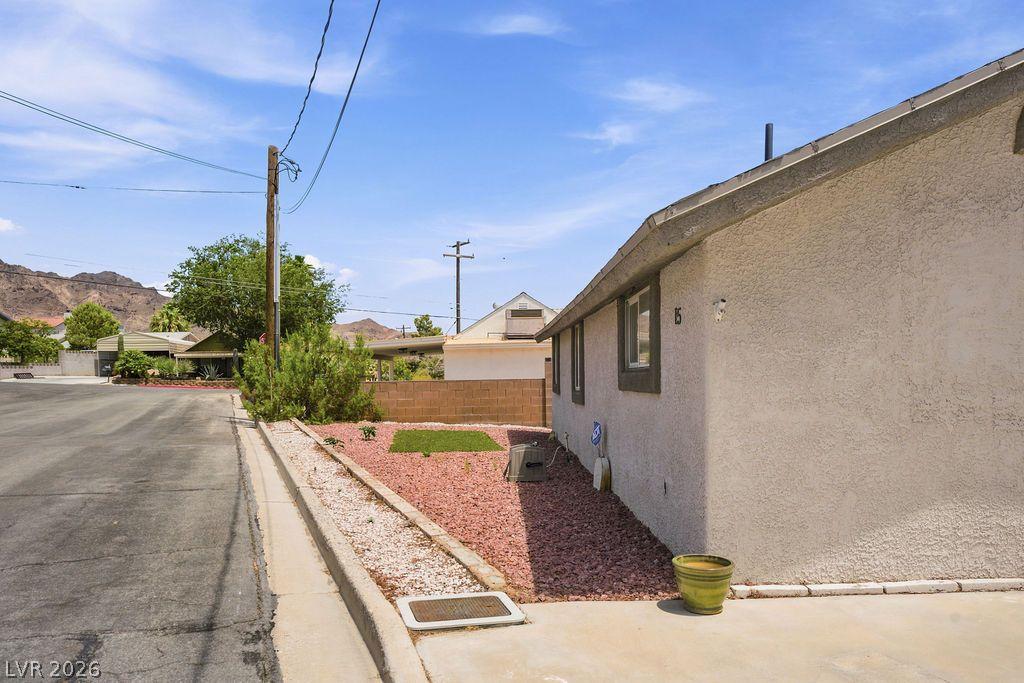 Image 4: Well-maintained stucco home nestled on a spacious
