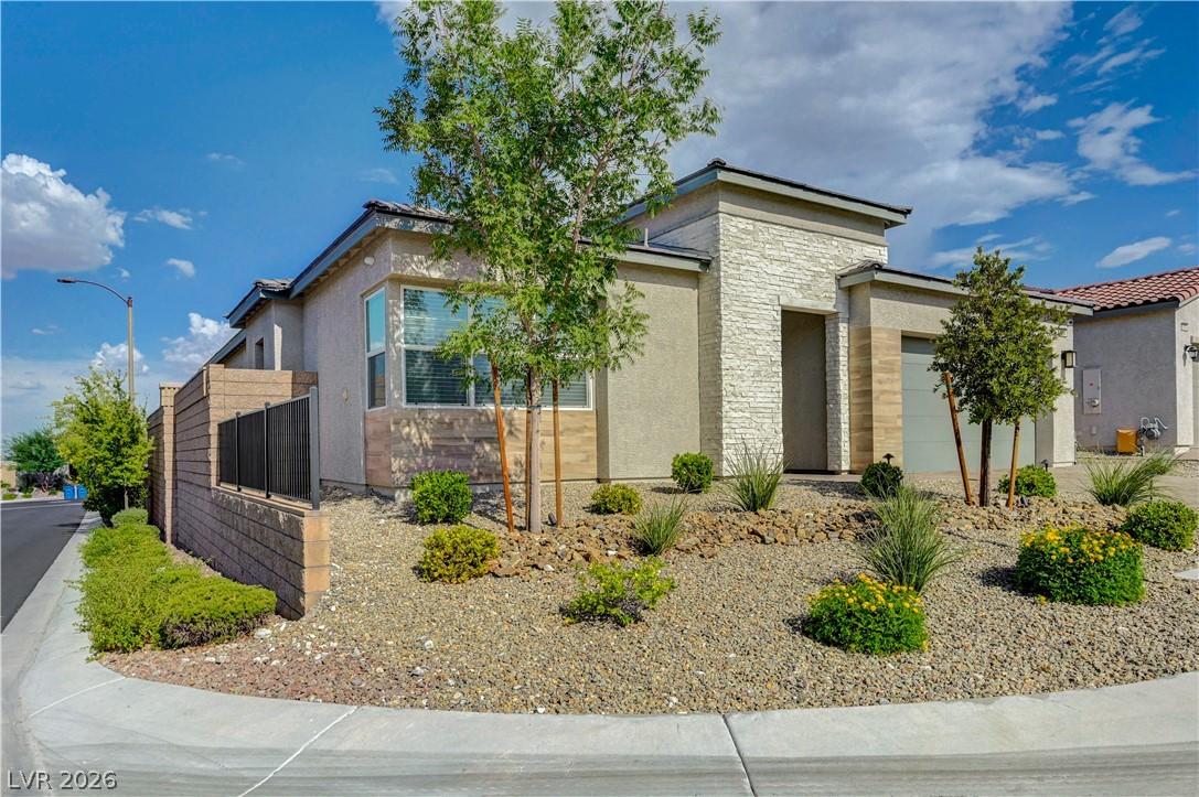 Image 2: A modern facade with varied textures, desert lands