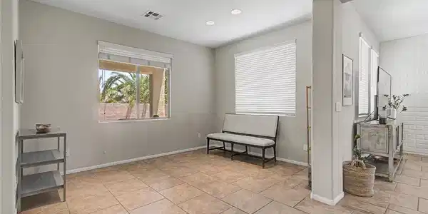Image 3: formal dining room right off of the kitchen.