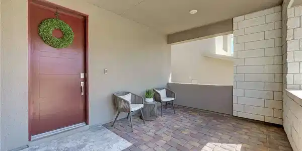 Image 2: A welcoming covered front porch features classic s