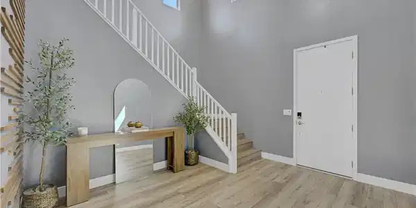 Image 4: Soaring ceilings and light wood floors create an a