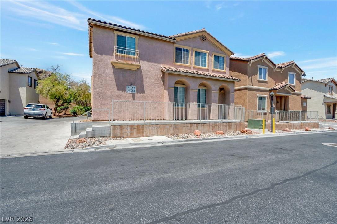Image 1: A terracotta-tiled roof crowns this residence, fea