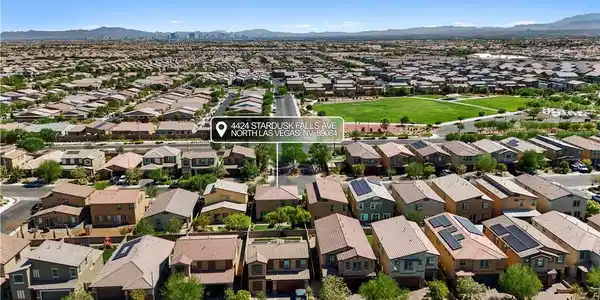 Image 4: An aerial perspective reveals a vast neighborhood