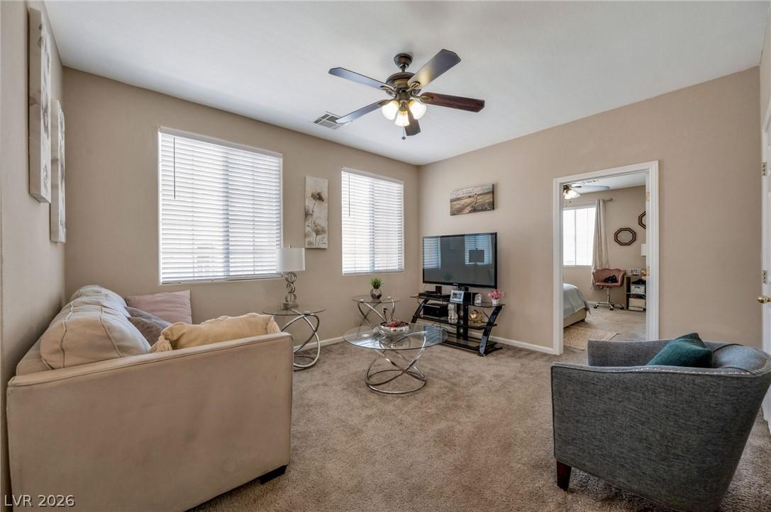 Image 4: A comfortable living space offers ample light and