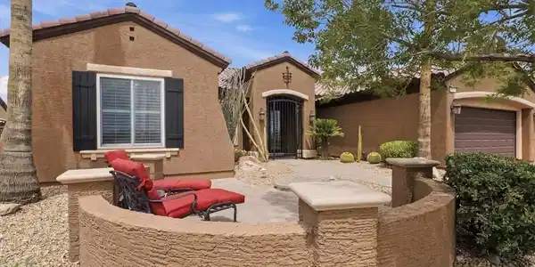 Image 3: An inviting front patio with desert landscaping of