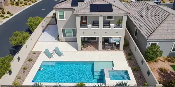 Image 4: An inviting backyard features a pristine swimming