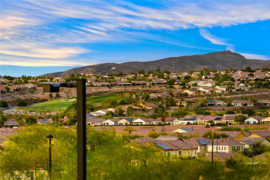 Image 4: Vast hillside community with a golf course, mounta