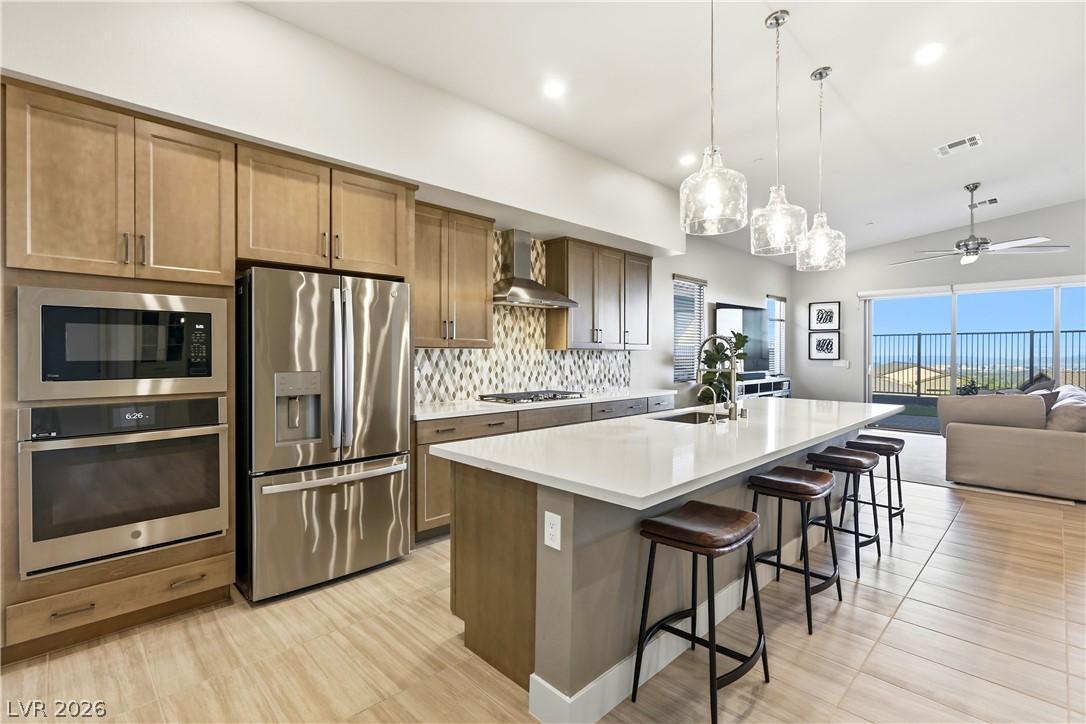 Image 3: Modern kitchen with an elongated island and stainl