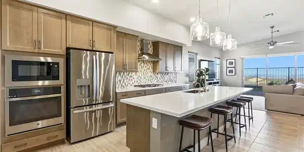 Image 3: Modern kitchen with an elongated island and stainl