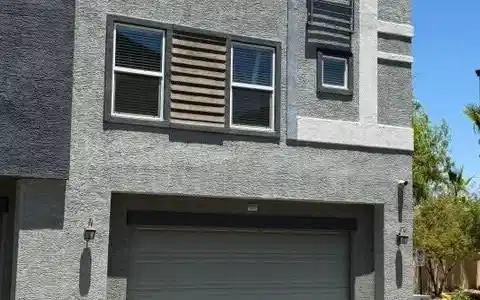Image 2: A contemporary exterior showcasing textured stucco