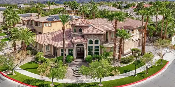 Image 3: An elegant tile-roofed estate stands prominently a