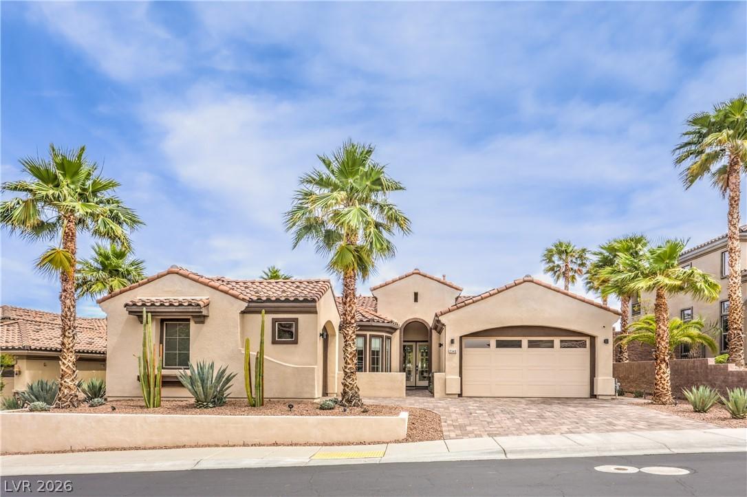 Image 1: This desert oasis features lush landscaping and a