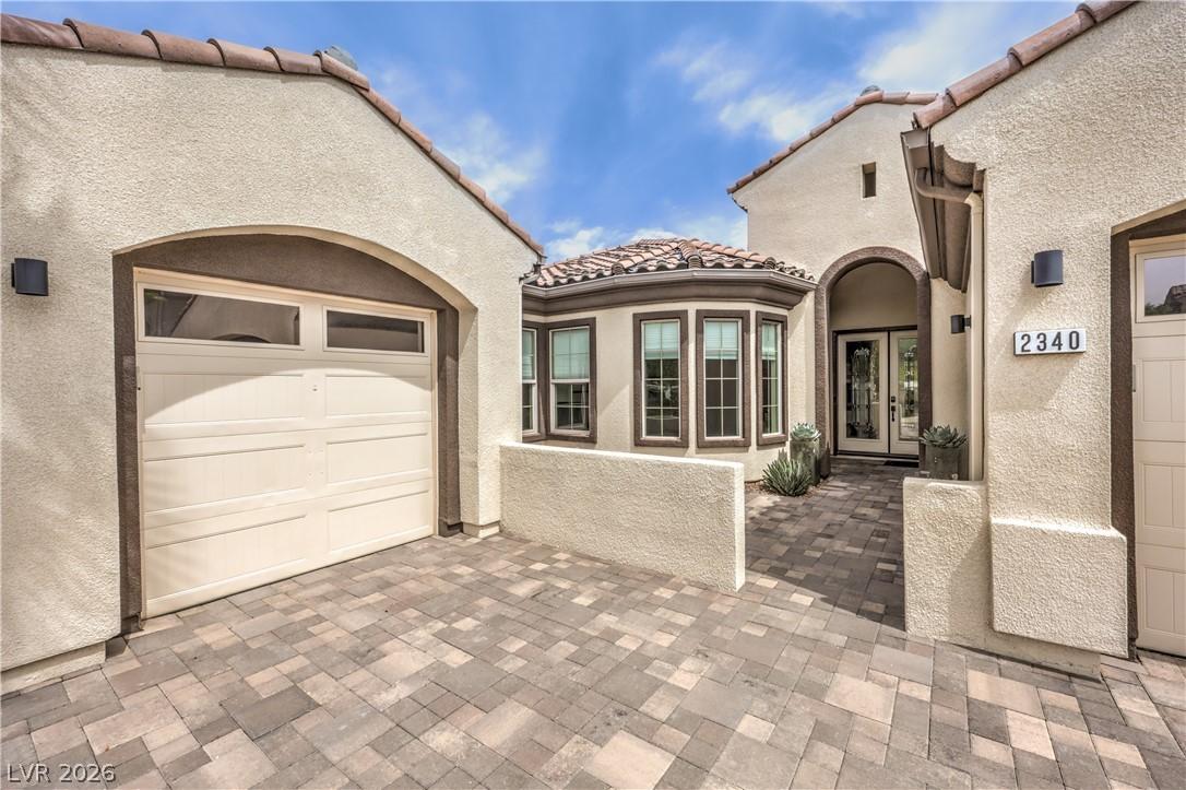 Image 3: This inviting home features a beautiful paved driv