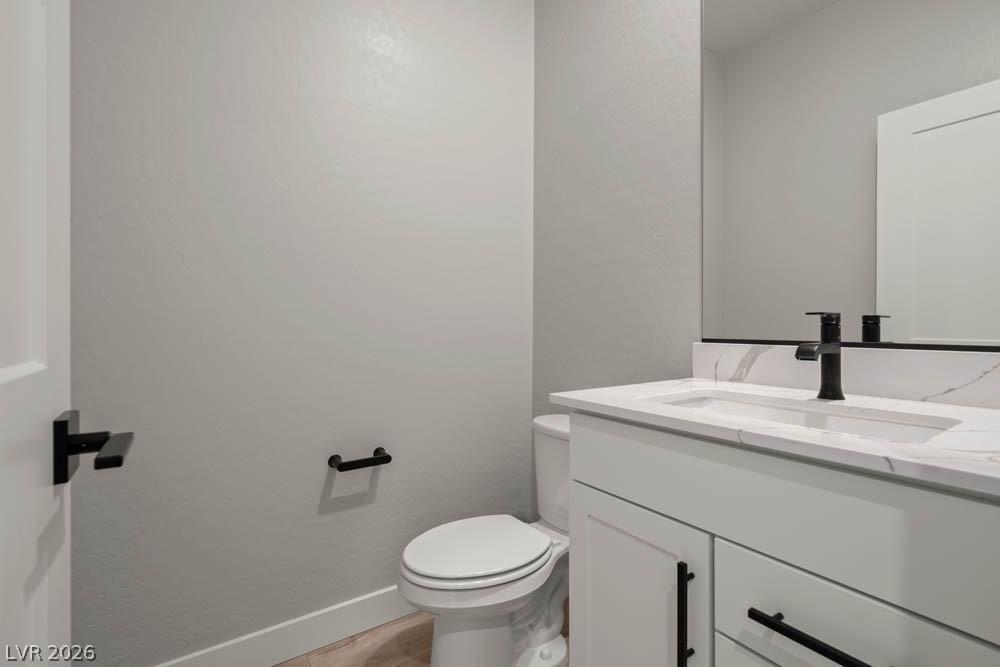 Image 4: This modern bathroom features a sleek vanity with