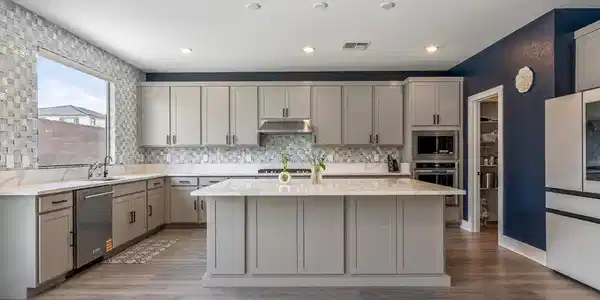 Image 3: A chef's dream kitchen offers a large center islan