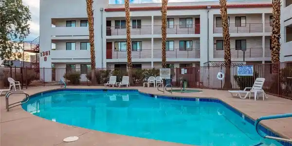 Image 2: A sparkling community pool offers a refreshing out