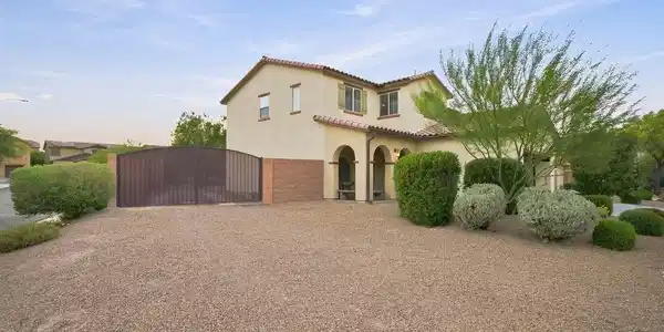 Image 3: Arched entryway details and tile roofing highlight