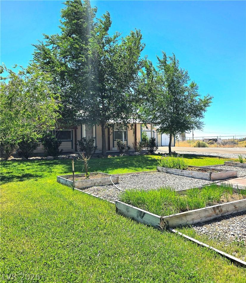 Image 4: A verdant lawn leads to a single-story home nestle