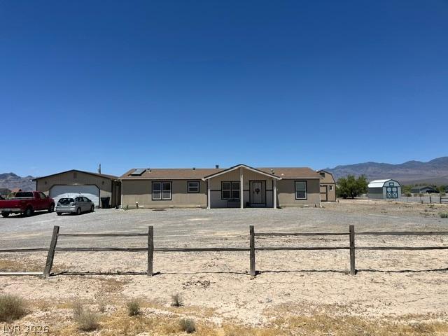 Image 2: A spacious desert homestead features a wide front
