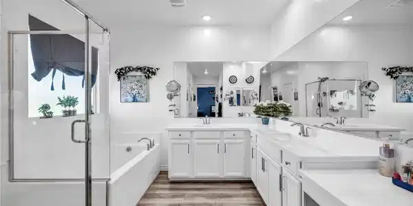Image 3: Bathroom with a stall shower, double vanity, a gar