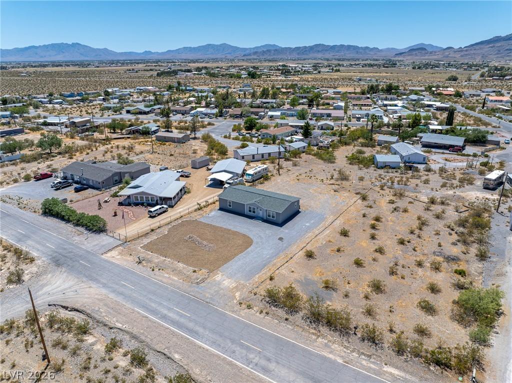 Image 3: An aerial perspective reveals a vast desert commun