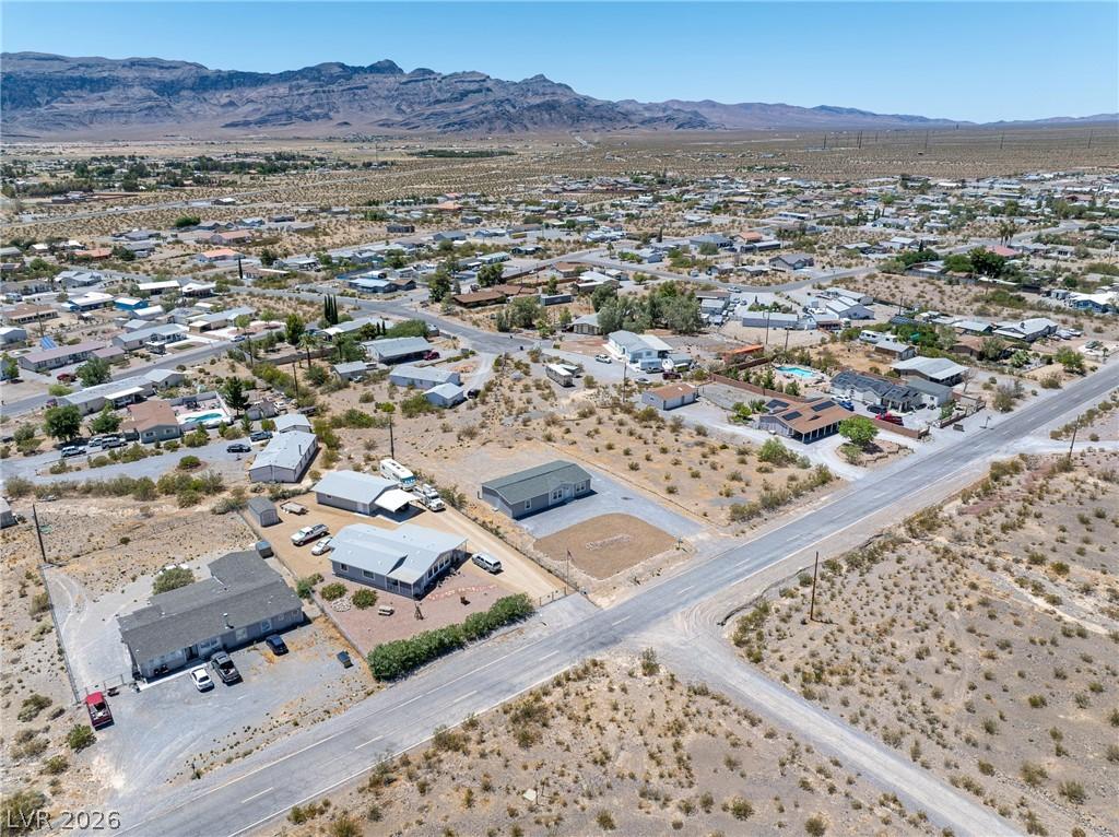 Image 4: An aerial perspective reveals a sprawling desert c