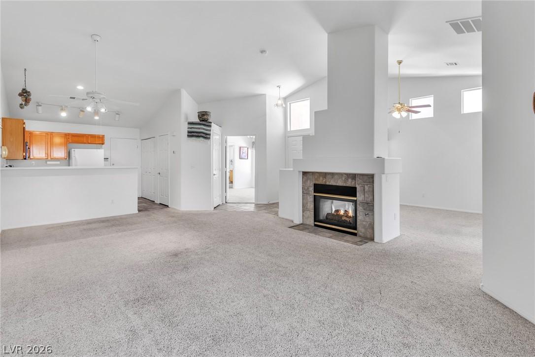 Image 2: Unfurnished living room featuring ceiling fan, lig