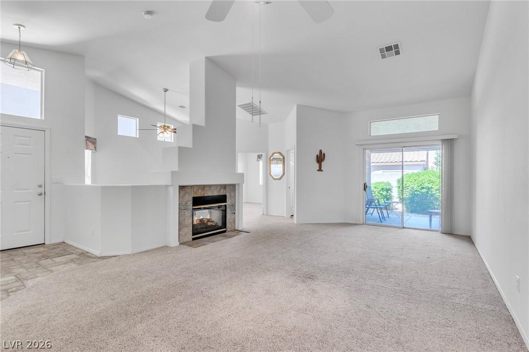 Image 3: Unfurnished living room with a ceiling fan, a tile
