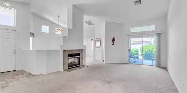 Image 3: Unfurnished living room with a ceiling fan, a tile