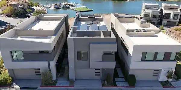 Image 3: Modern multi-level homes stand prominently alongsi