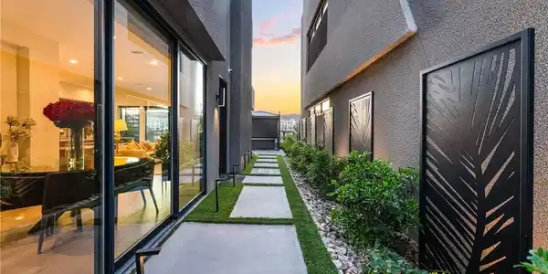 Image 4: A modern stone path guides you along the sleek stu