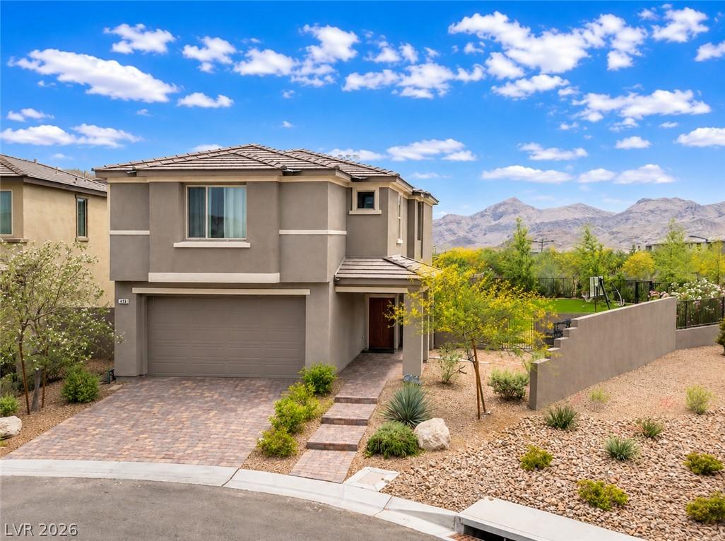 Image 1: A desert-friendly landscape surrounds this welcomi