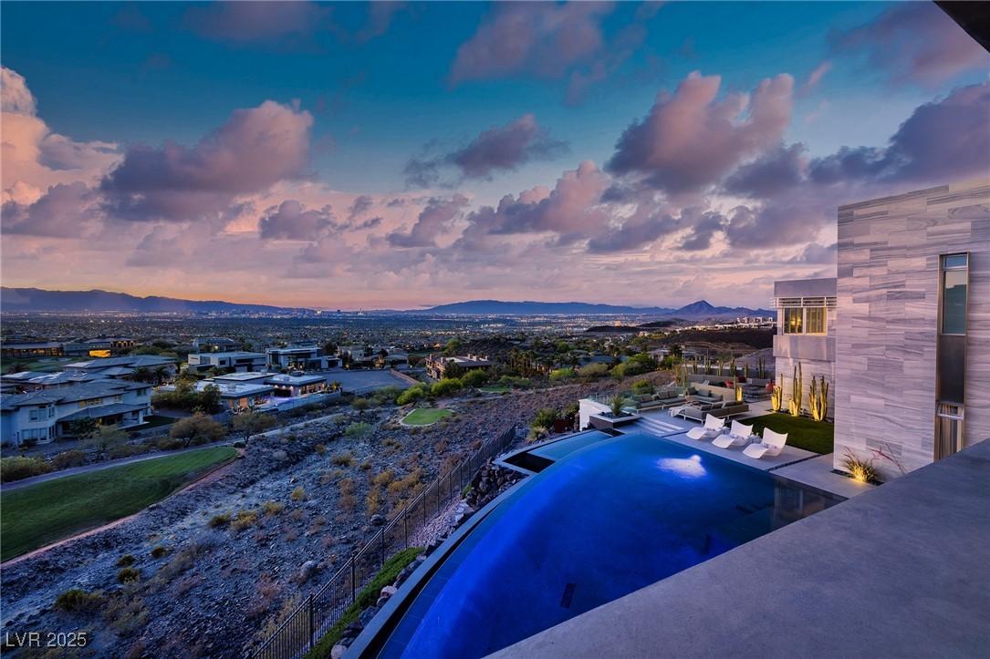 Image 1: View of swimming pool with a mountain view