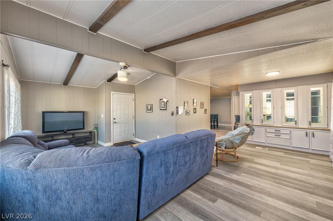 Image 1: Living area with light wood-style flooring, plenty