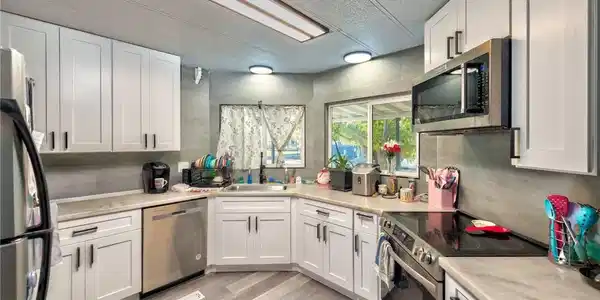 Image 4: Kitchen featuring stainless steel appliances, whit