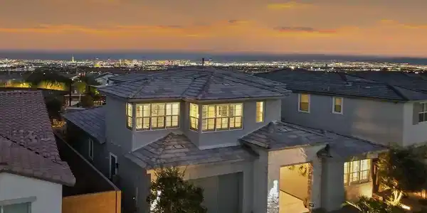 Image 2: Distant city lights shimmer behind a multi-level s