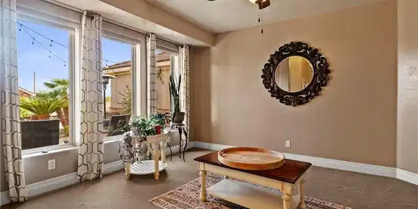 Image 4: Formal living room adjacent to foyer