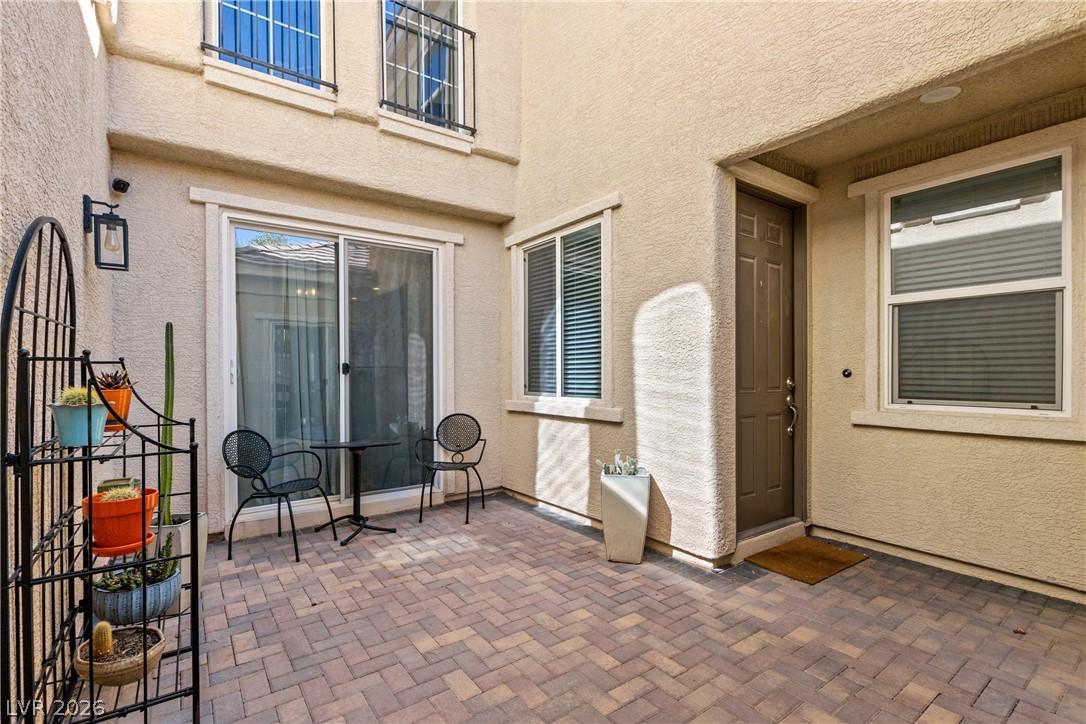 Image 3: An inviting paver patio provides a charming outdoo