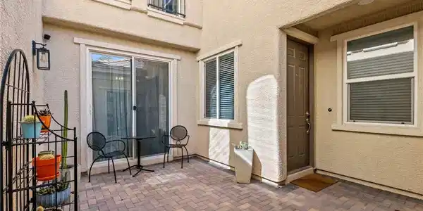 Image 3: An inviting paver patio provides a charming outdoo