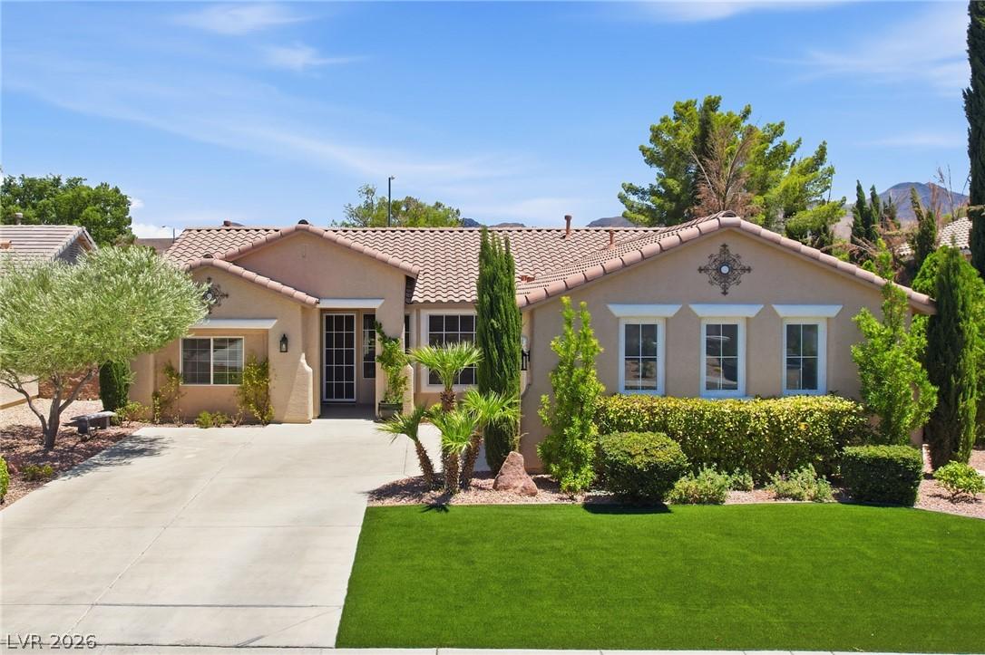 Image 2: A terracotta tile roof crowns this inviting reside