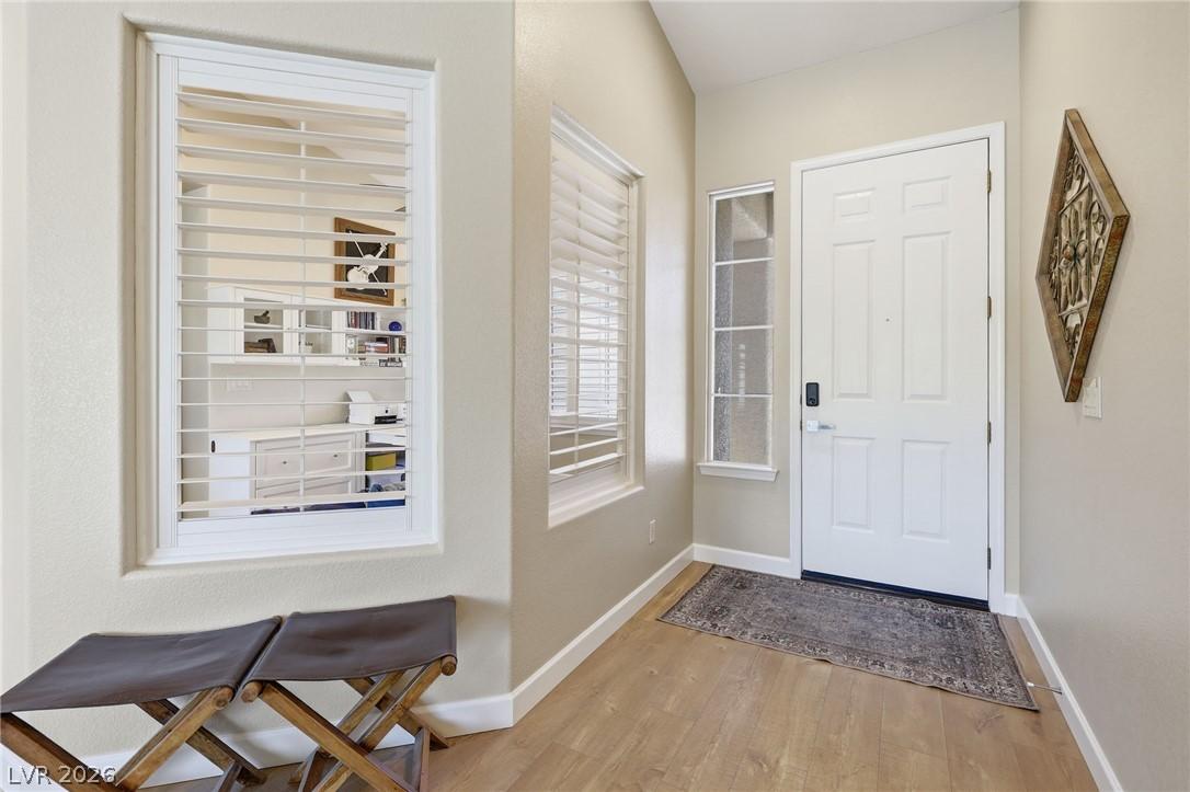 Image 4: A welcoming entryway with light wood flooring and