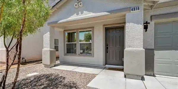 Image 2: A welcoming covered entry leads to a private front