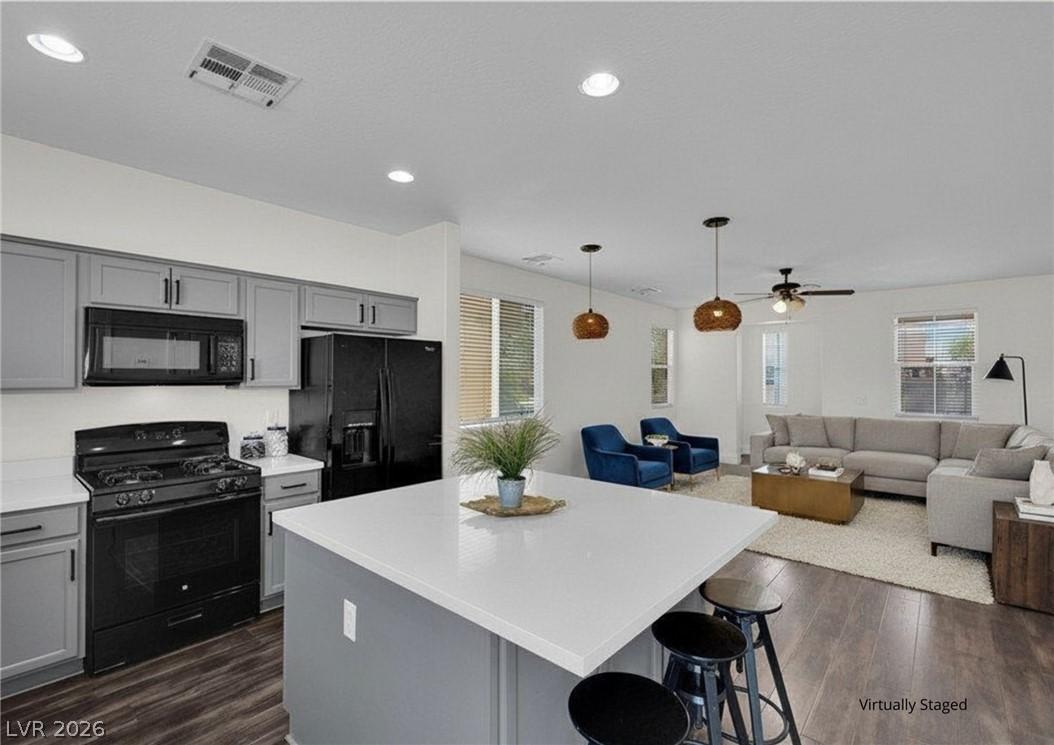 Image 4: An open-concept living space integrates a well-app