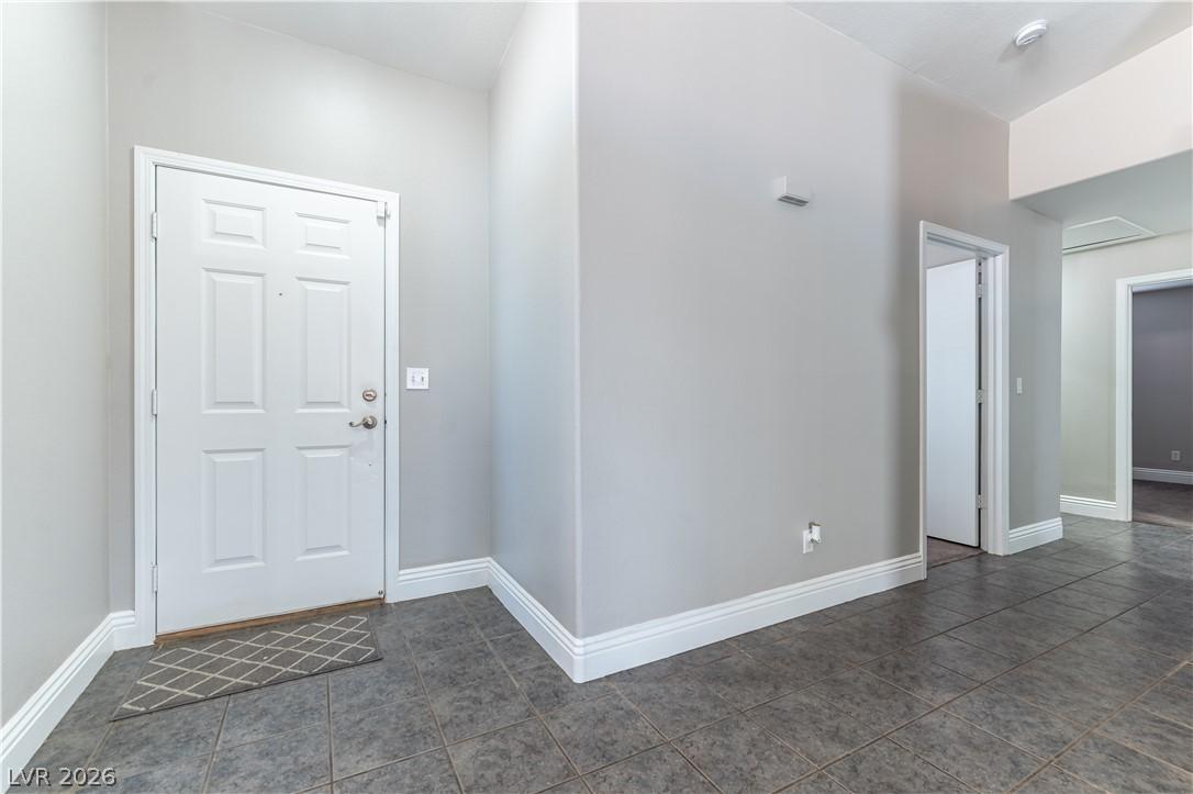 Image 3: A welcoming entryway with durable tile flooring cr