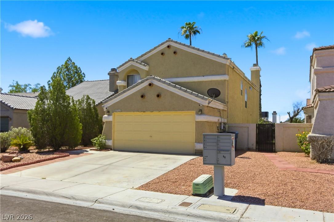 Image 2: A traditional home with an attached garage, featur