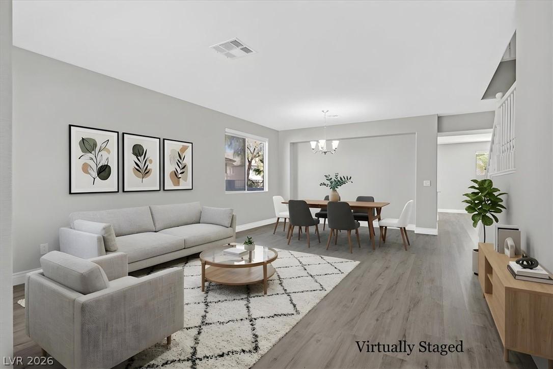 Image 2: Sun-filled living and dining areas flow together,