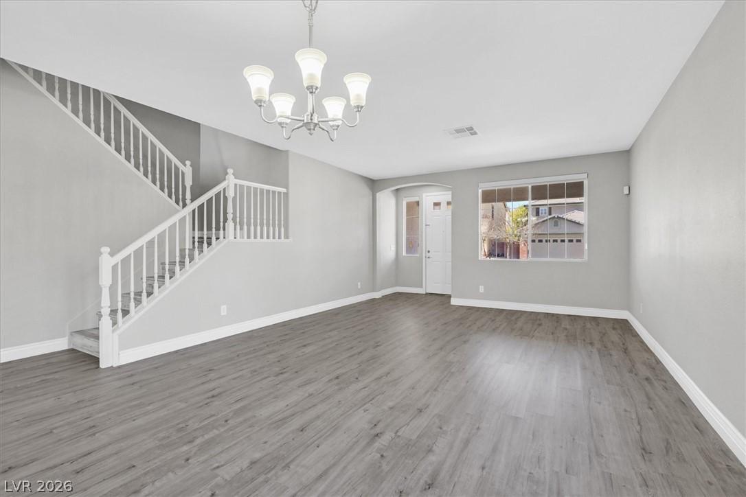 Image 3: A graceful staircase with crisp white balusters co