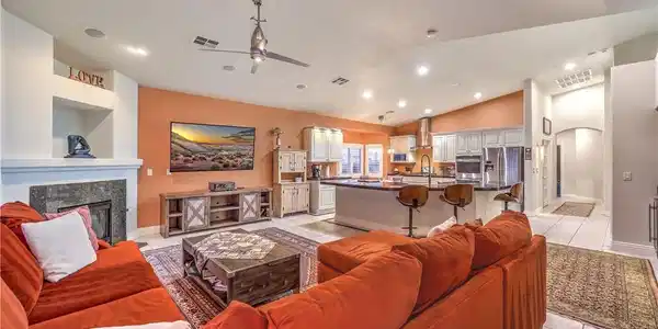 Image 3: Tile flooring and high ceilings define this spacio