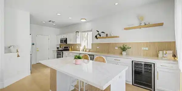 Image 2: Smooth stone countertops and recessed lighting ele