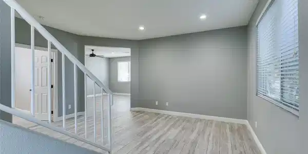 Image 4: Clean lines and wood-look flooring define this ope